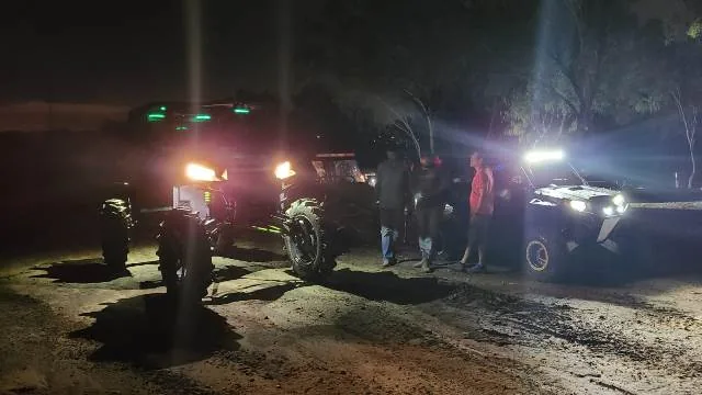UTV riding at night with headlights on at 281 Offroad Park