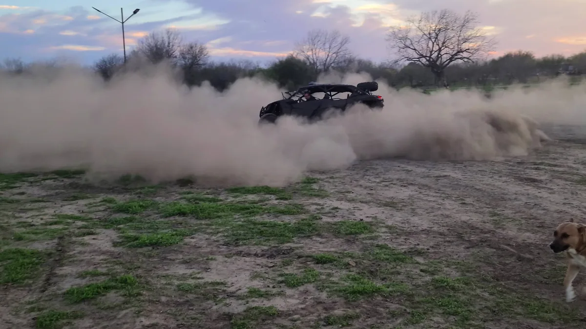 Can-Am UTV kicking up a dust cloud burnout at 281 Country Club, San Antonio