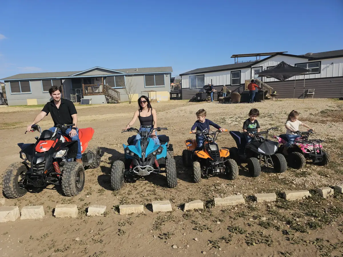 Family group with ATVs at 281 Country Club, San Antonio